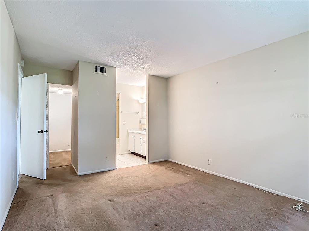 11485 Oakhurst Road, Unit 107 Largo, FL 33774 - Photo 29 of 60 a view of an empty room and closet area