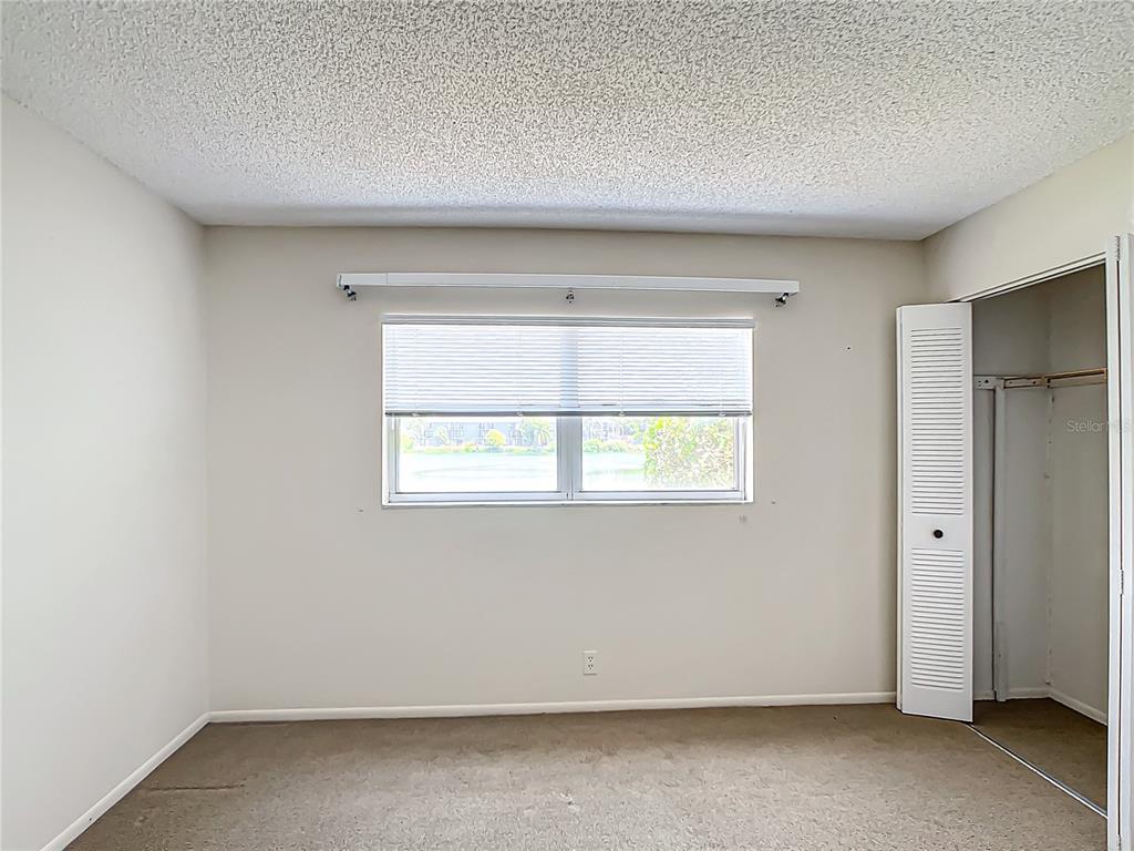 11485 Oakhurst Road, Unit 107 Largo, FL 33774 - Photo 38 of 60 an empty room with a window