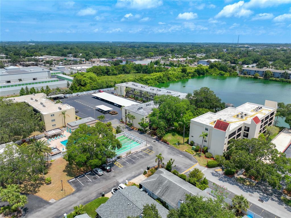 11485 Oakhurst Road, Unit 107 Largo, FL 33774 - Photo 50 of 60 an aerial view of a house with a lake view