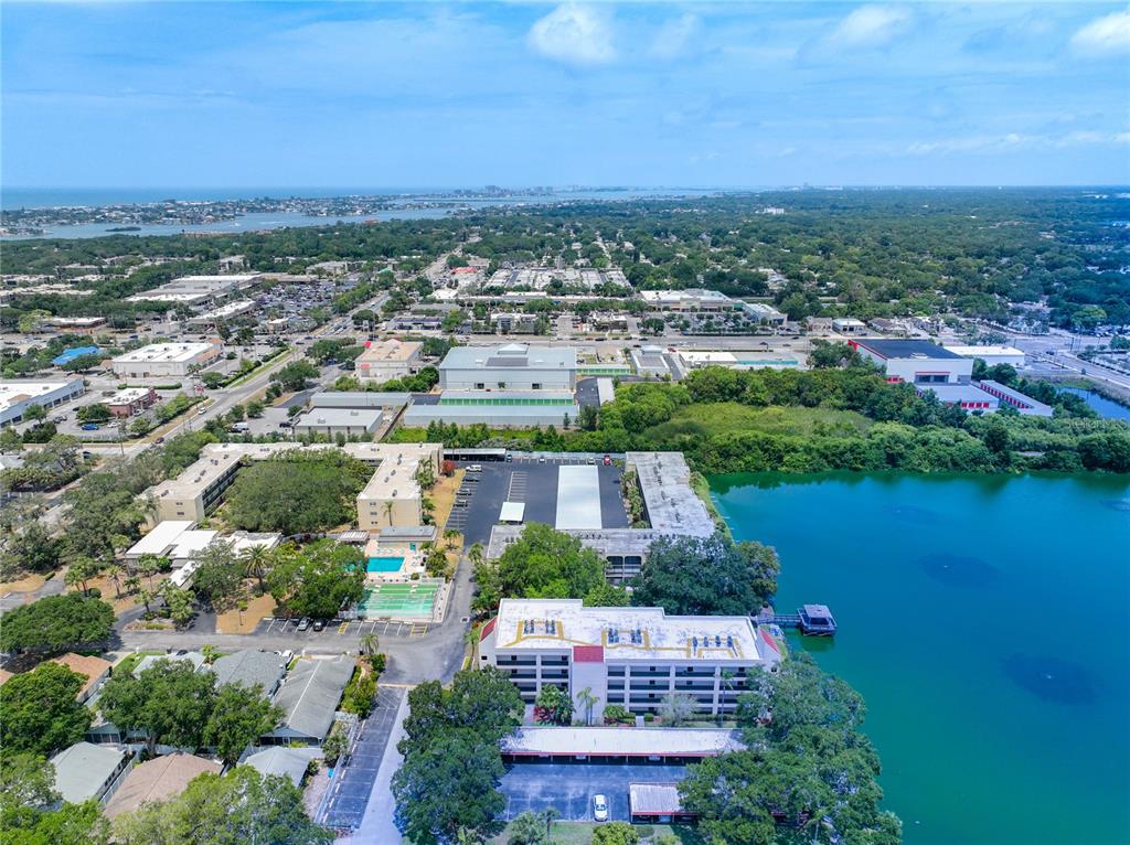 11485 Oakhurst Road, Unit 107 Largo, FL 33774 - Photo 8 of 60 an aerial view of a house with a lake view