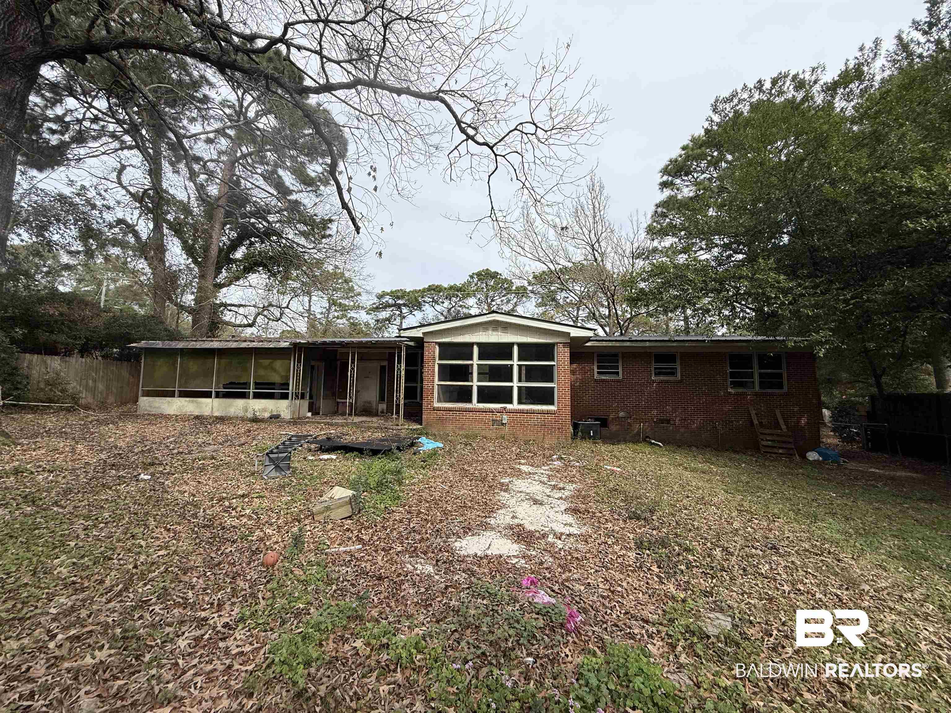 4003 Michael Boulevard Mobile, AL 36609 - Photo 2 of 2 View of front of house featuring a sunroom and brick siding