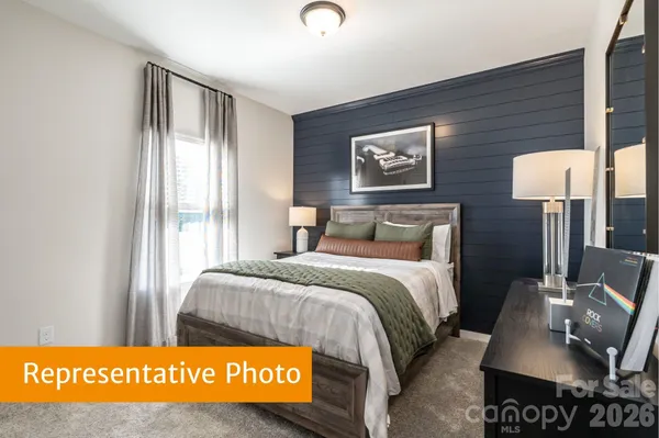 a bedroom with a bed and a table in it