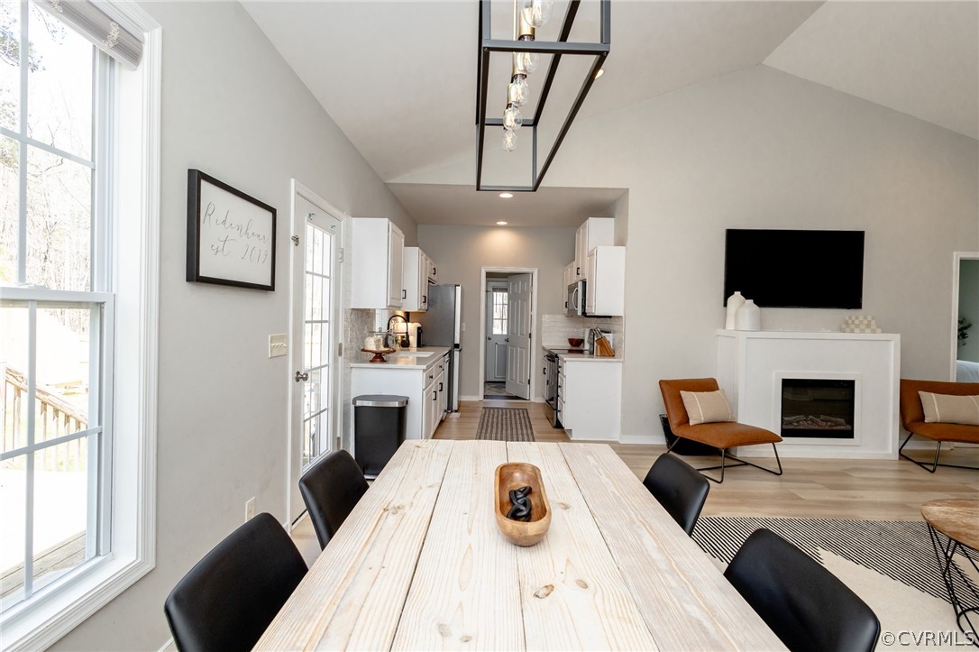 2406 Emanuel Church Road Powhatan, VA 23139 - Photo 14 of 50 a living room with furniture a fireplace and a flat screen tv