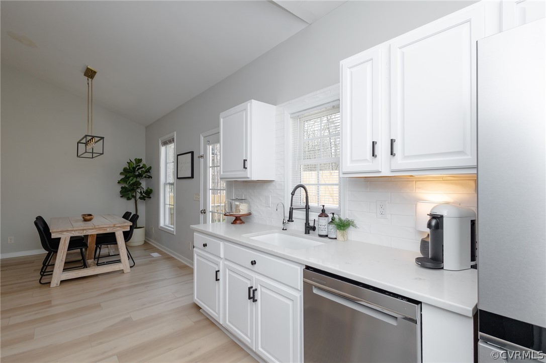 2406 Emanuel Church Road Powhatan, VA 23139 - Photo 16 of 50 a kitchen with cabinets and chairs