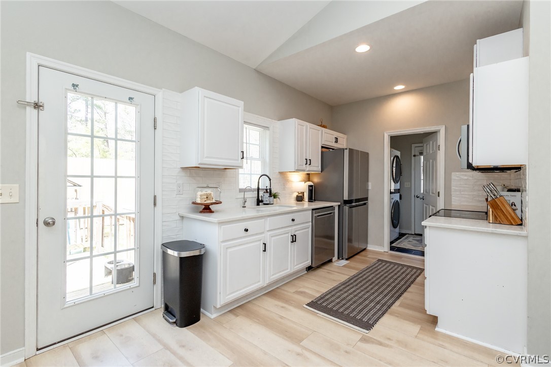 2406 Emanuel Church Road Powhatan, VA 23139 - Photo 17 of 50 a kitchen with sink a refrigerator and cabinets