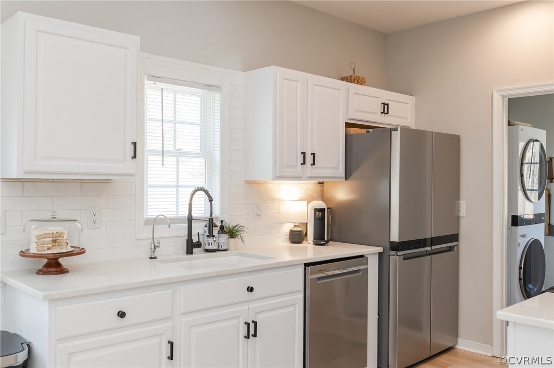 2406 Emanuel Church Road Powhatan, VA 23139 - Photo 18 of 50 a kitchen with stainless steel appliances a refrigerator sink and cabinets