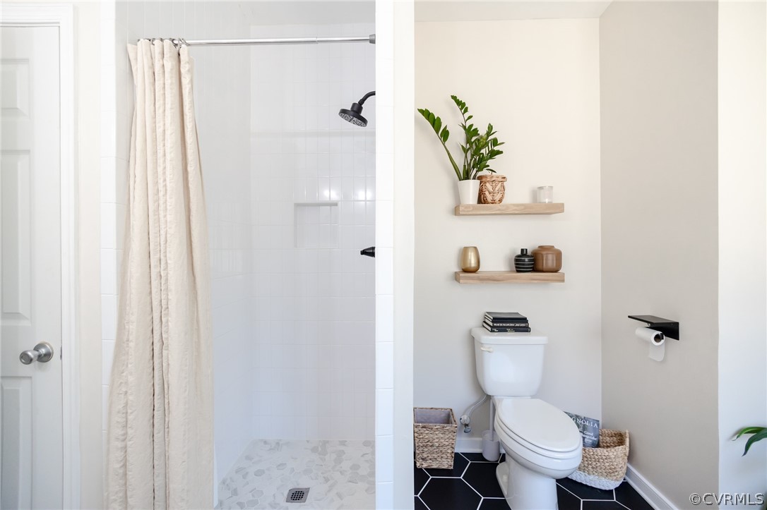 2406 Emanuel Church Road Powhatan, VA 23139 - Photo 29 of 50 a white toilet sitting next to a bathroom sink