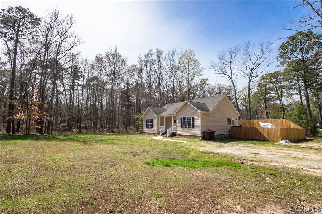 2406 Emanuel Church Road Powhatan, VA 23139 - Photo 3 of 50 a front view of a house with a yard and trees