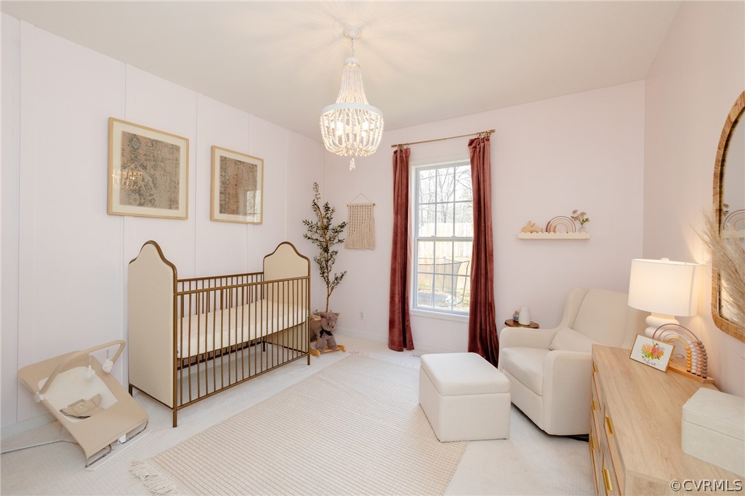 2406 Emanuel Church Road Powhatan, VA 23139 - Photo 32 of 50 a living room with furniture and a baby crib