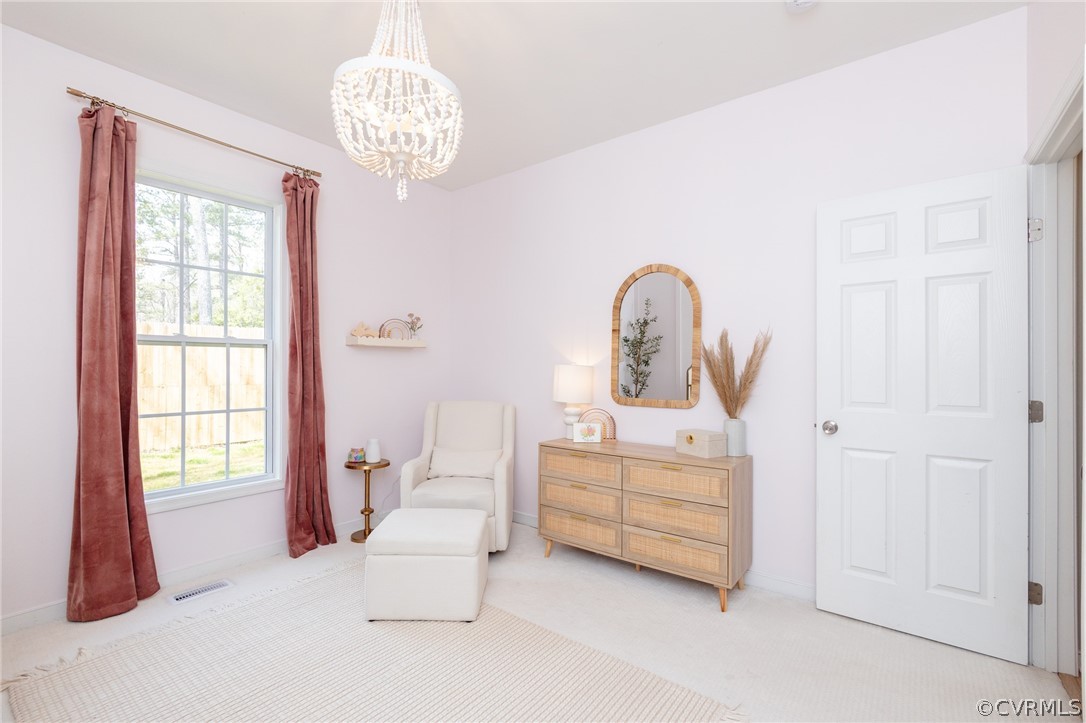 2406 Emanuel Church Road Powhatan, VA 23139 - Photo 33 of 50 a bedroom with a bed and a chandelier