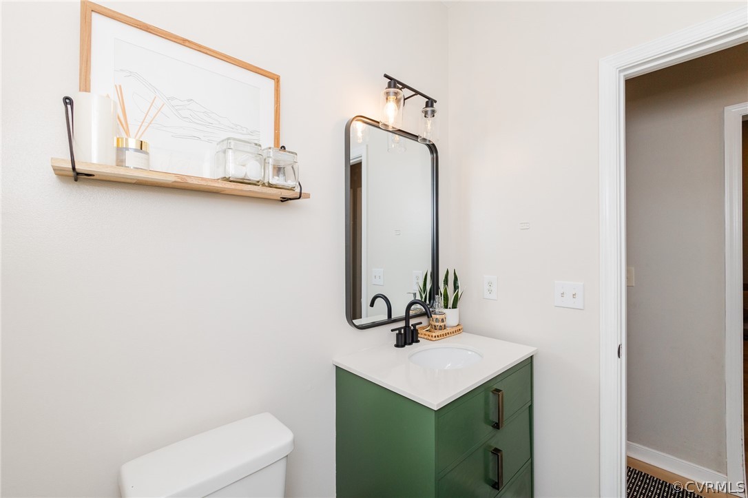 2406 Emanuel Church Road Powhatan, VA 23139 - Photo 39 of 50 a bathroom with a toilet sink and mirror