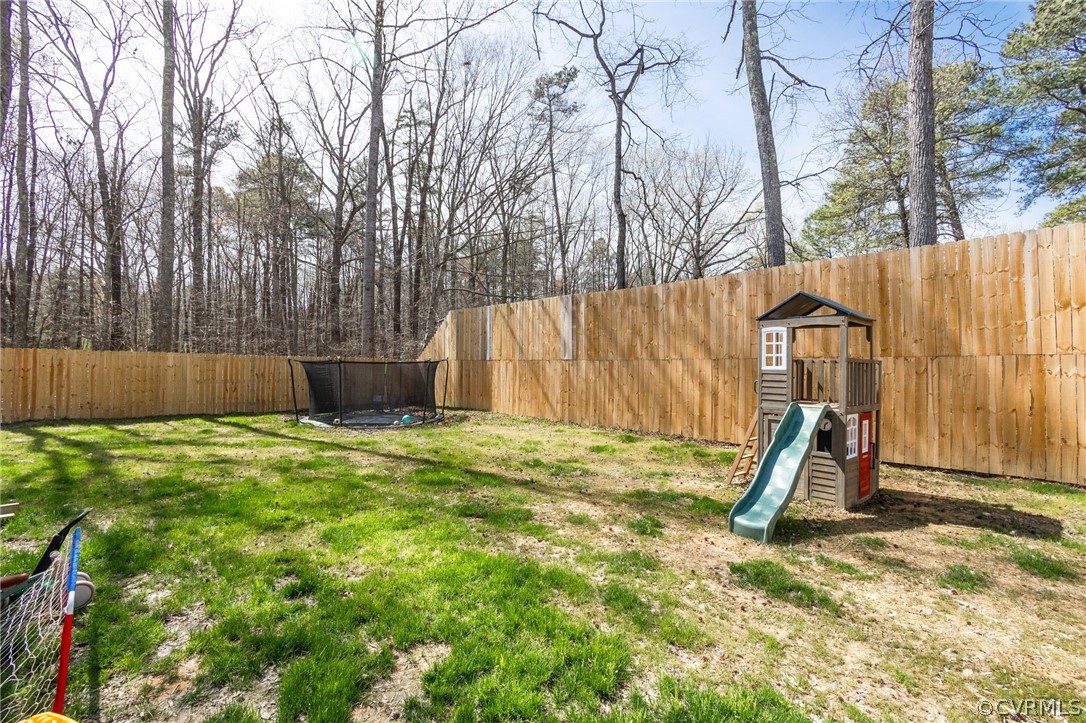 2406 Emanuel Church Road Powhatan, VA 23139 - Photo 48 of 50 a backyard of a house with lots of green space