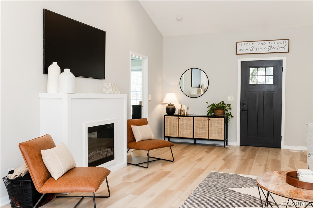 2406 Emanuel Church Road Powhatan, VA 23139 - Photo 9 of 50 a living room with furniture a fireplace and a flat screen tv