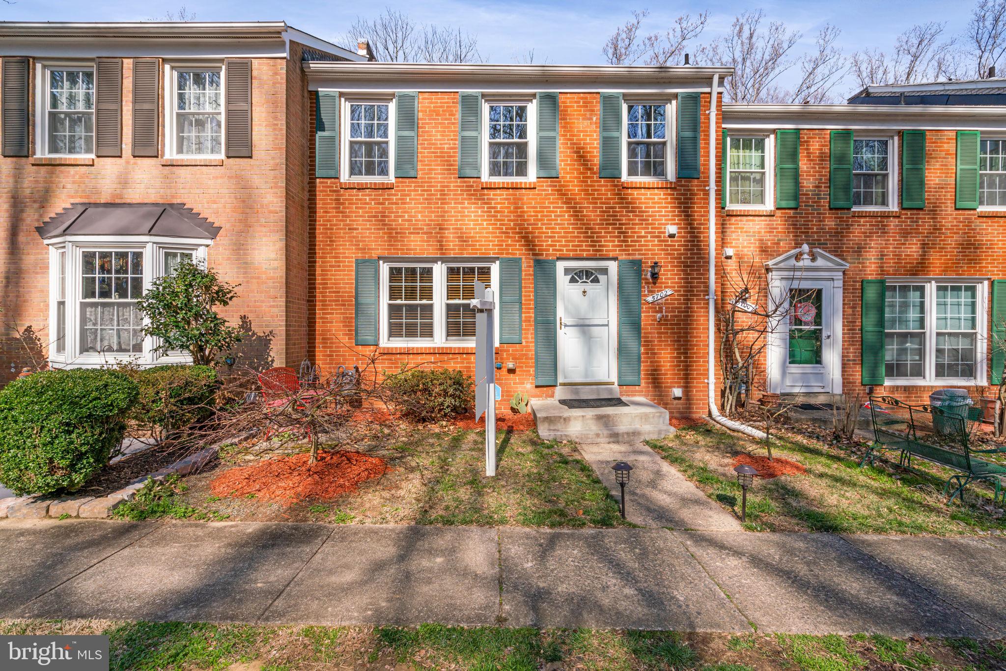 5702 Kirkham Court Springfield, VA 22151 - Photo 2 of 36 front view of a brick house with a yard