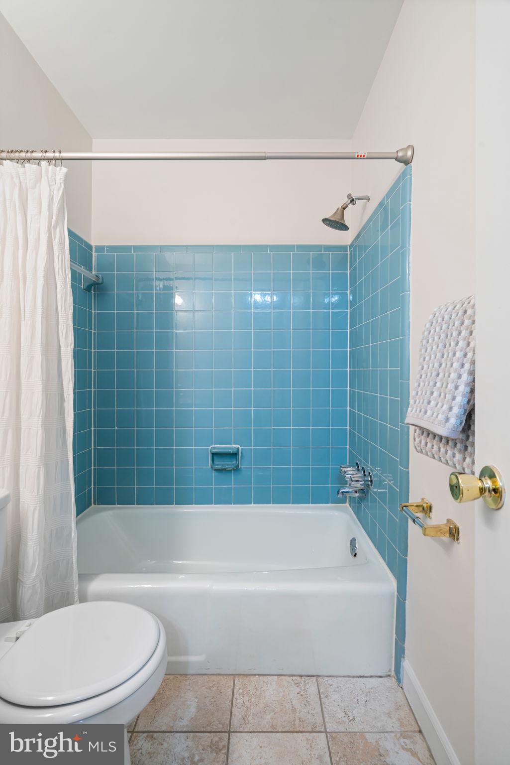 5702 Kirkham Court Springfield, VA 22151 - Photo 29 of 36 a bathroom with a bathtub and shower