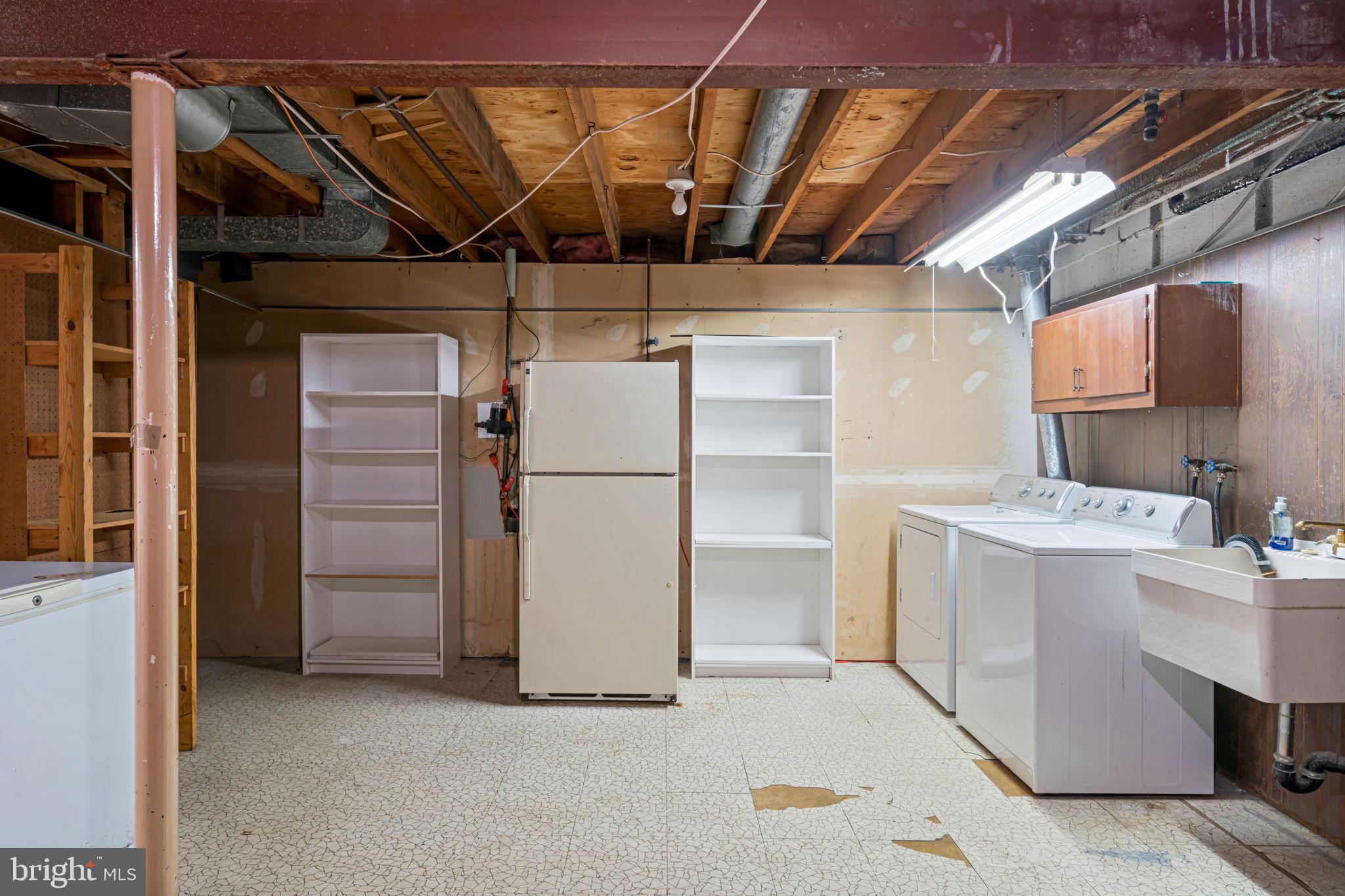 5702 Kirkham Court Springfield, VA 22151 - Photo 31 of 36 a utility room with dryer and washer