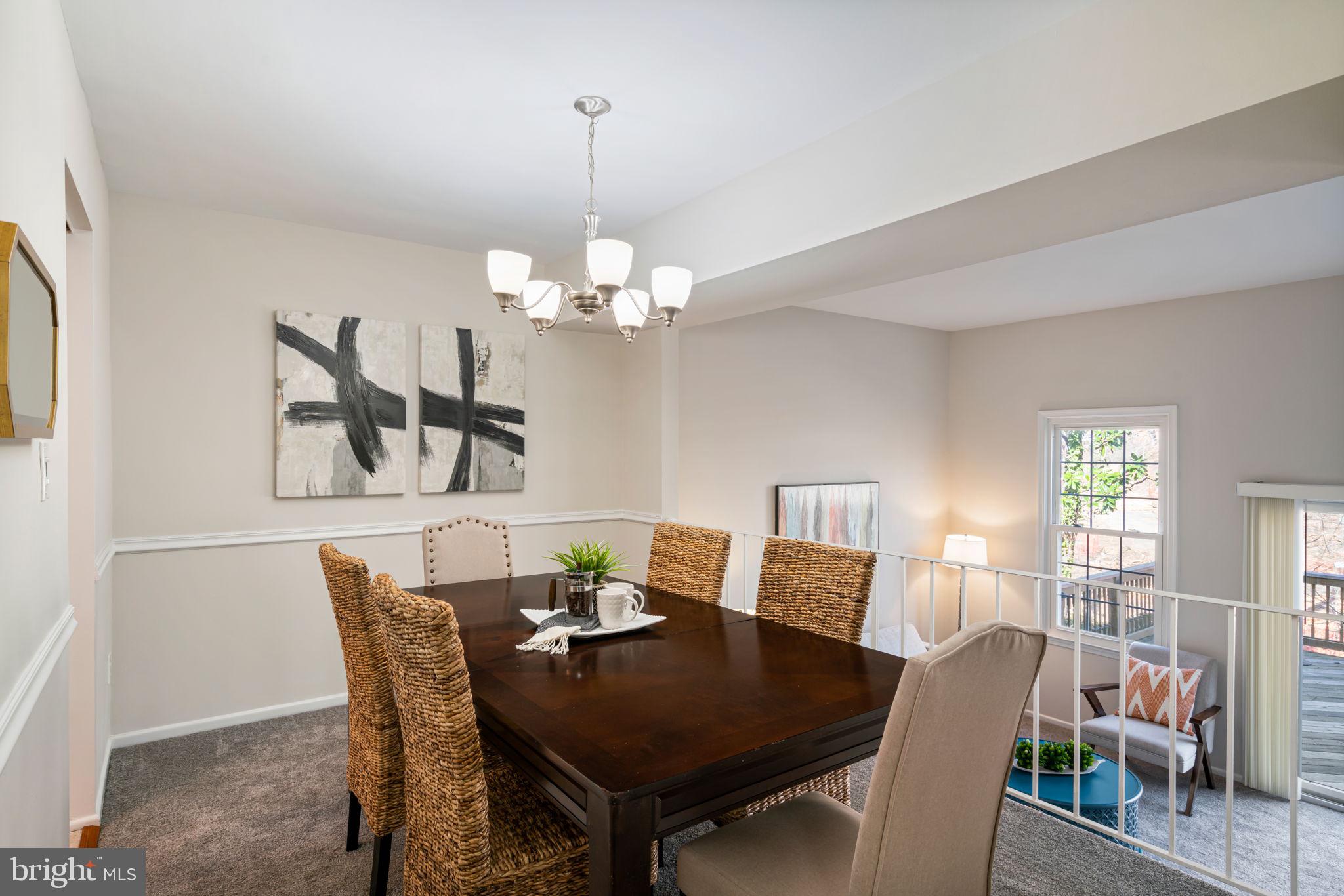 5702 Kirkham Court Springfield, VA 22151 - Photo 10 of 36 a view of a dining room with furniture and wooden floor