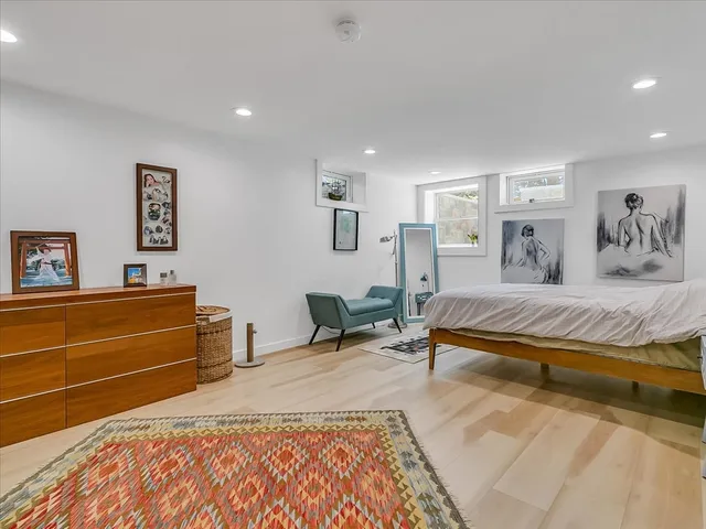 a bedroom with a bed and a dresser