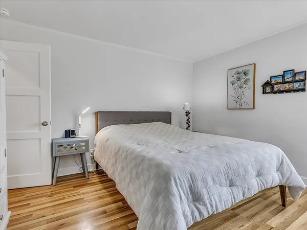 a bed room with a bed and a desk