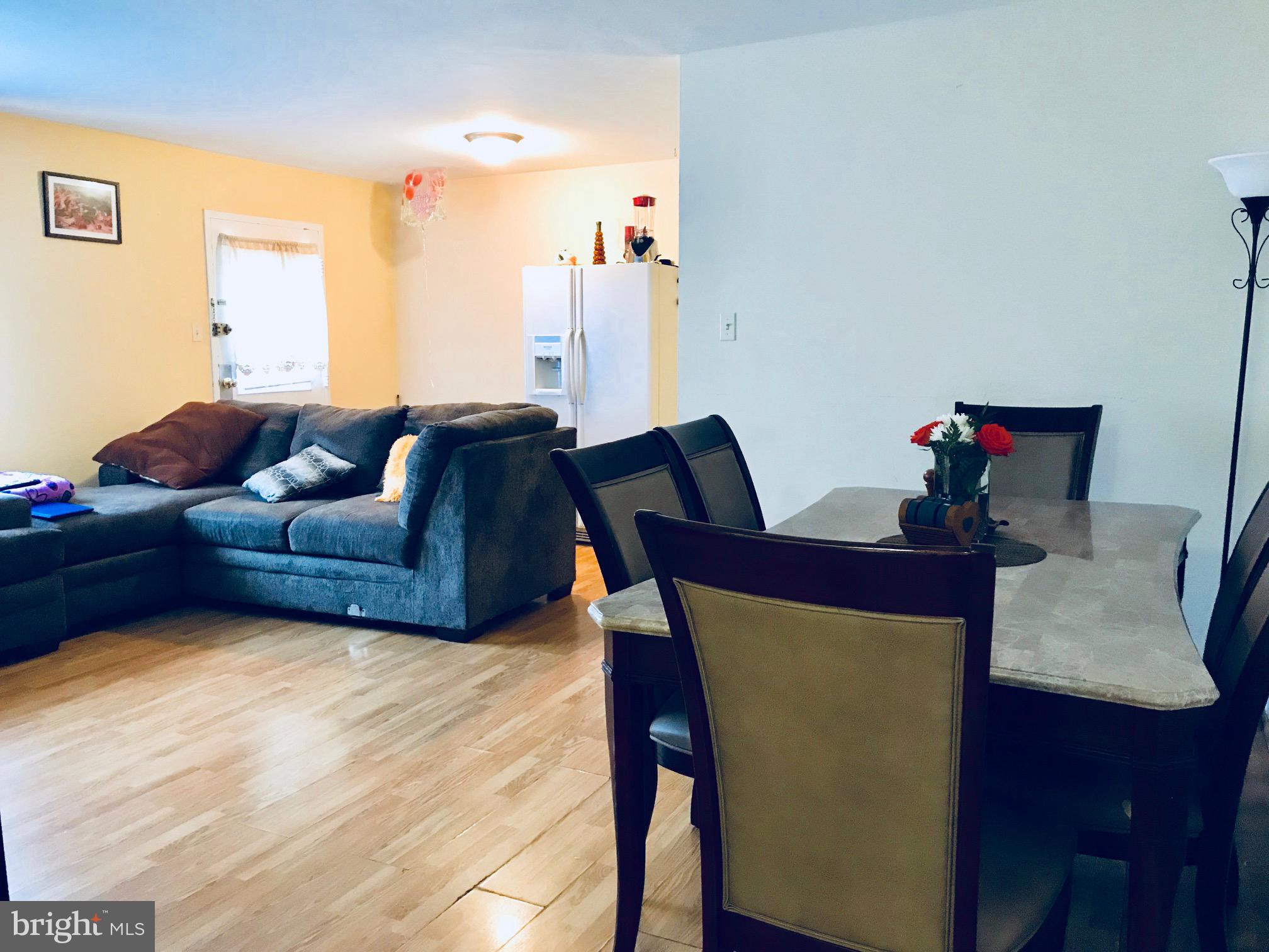 8601 Manchester Road, Unit 105 Silver Spring, MD 20901 - Photo 4 of 10 Living room/dining room combo