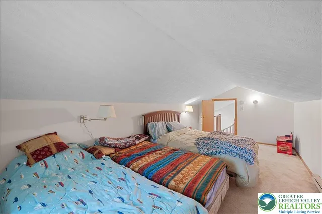 a view of a patio with table and chairs under an umbrella with a patio