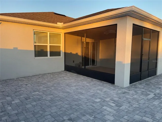 a view of a house with a backyard