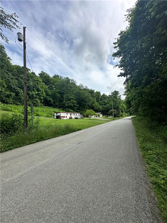 0 Johnson Hollow Road Fayette City, PA 15438 - Photo 21 of 42 a view of a street both side of grassy field with shrub