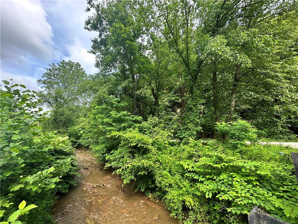 0 Johnson Hollow Road Fayette City, PA 15438 - Photo 3 of 42 a view of a lush green forest with lawn chairs