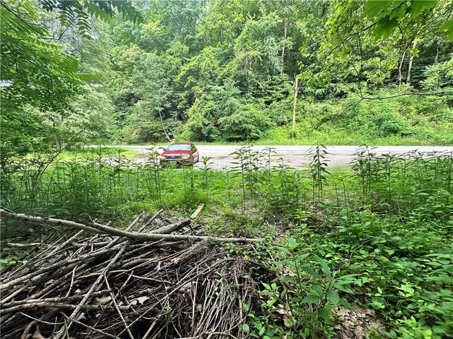 a view of a field with an outdoor space