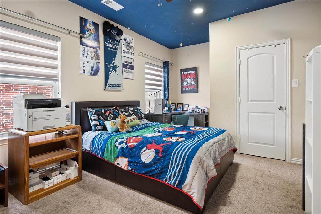 8268 Kara Creek Road Frisco, TX 75036 - Photo 22 of 31 Bedroom featuring a unique blue ceiling treatment, plush carpet flooring, and neutral wall paint