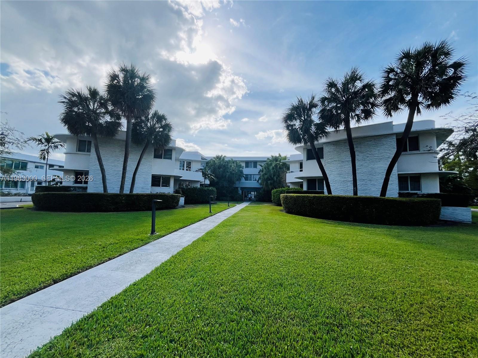 10190 Collins Avenue, Unit 106 Bal Harbour, FL 33154 - Photo 1 of 21 a view of a house with a yard