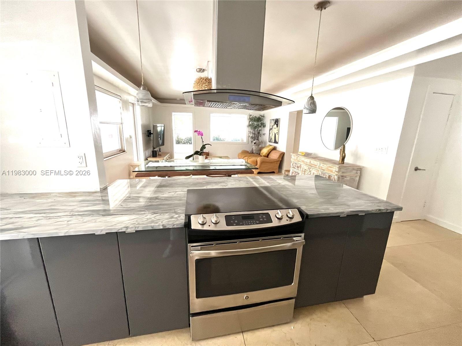 10190 Collins Avenue, Unit 106 Bal Harbour, FL 33154 - Photo 12 of 21 a kitchen with a stove and a sink