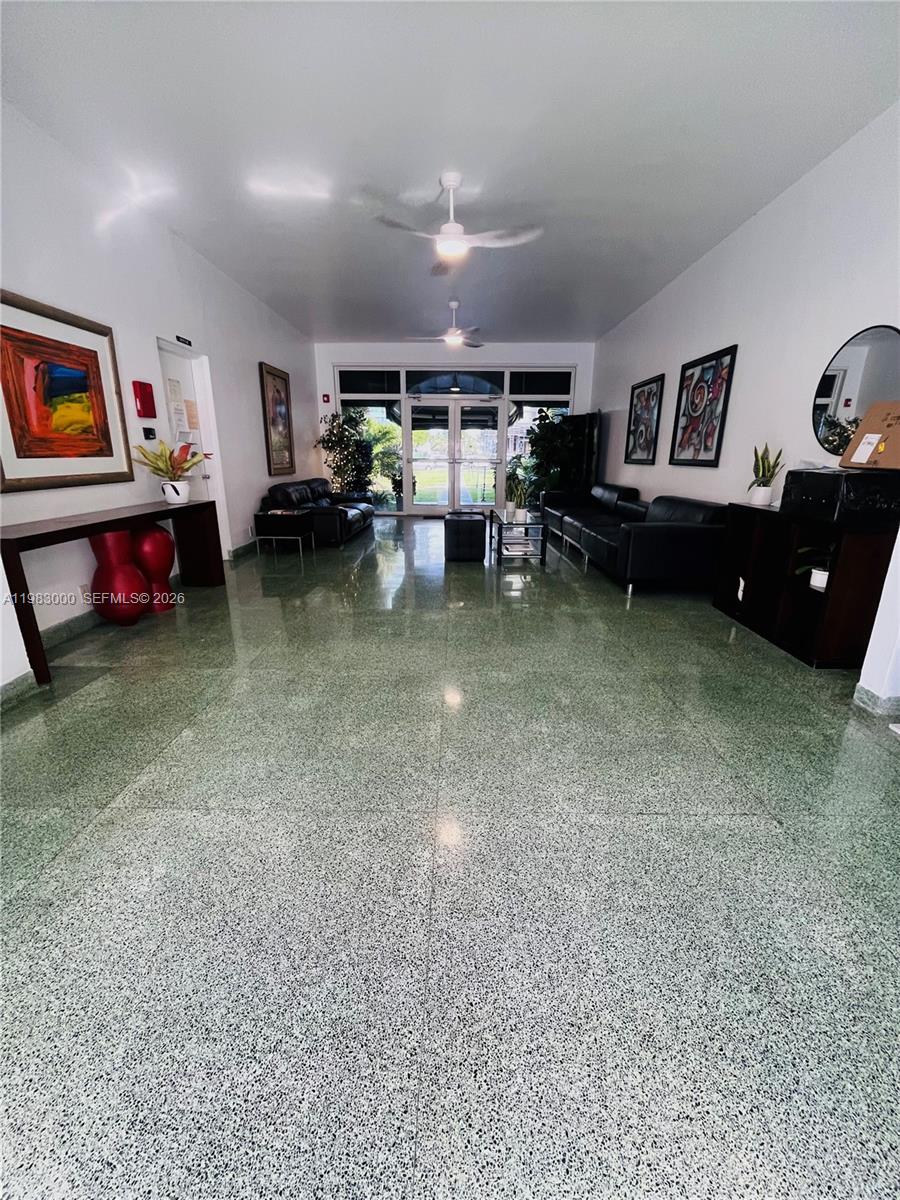 10190 Collins Avenue, Unit 106 Bal Harbour, FL 33154 - Photo 3 of 21 a living room with furniture and a pool table