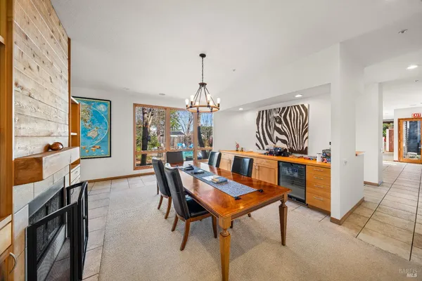 a view of a livingroom with furniture and a kitchen