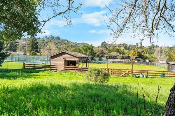 a view of a house with a big yard
