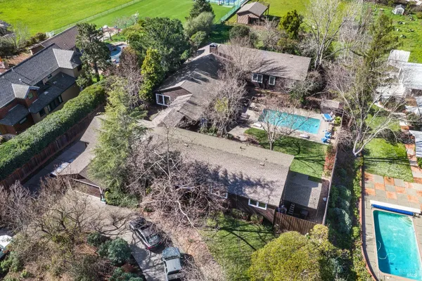 an aerial view of houses with yard
