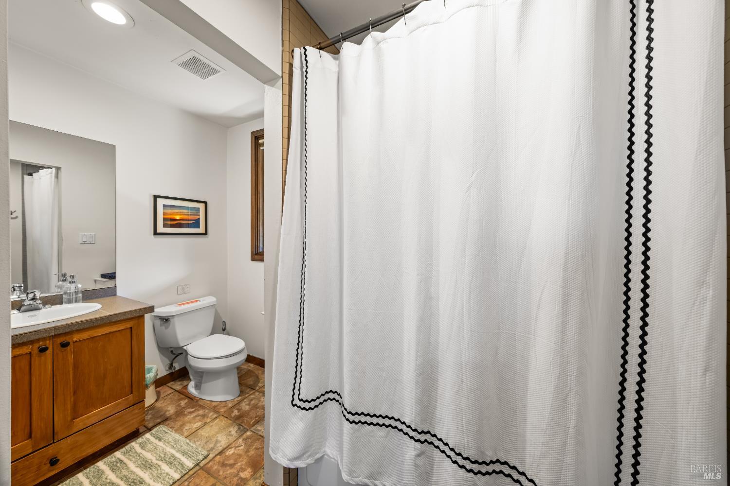 8 Circle Road San Rafael, CA 94903 - Photo 5 of 48 a bathroom with a toilet a sink and a mirror