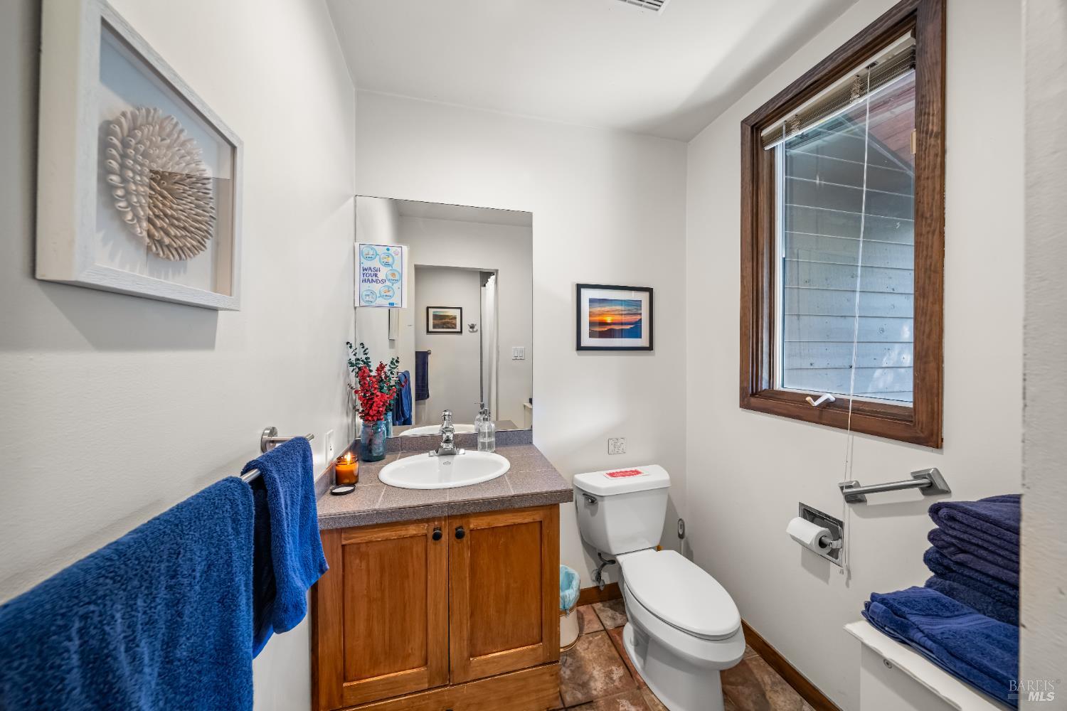 8 Circle Road San Rafael, CA 94903 - Photo 7 of 48 a bathroom with a toilet a sink and a mirror