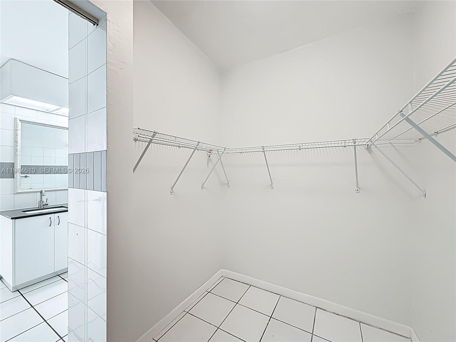 6819 Southwest 25th Street Miami, FL 33155 - Photo 15 of 25 a view of a kitchen with white cabinets and white appliances