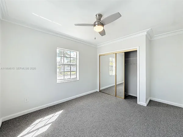 a view of an empty room with a window