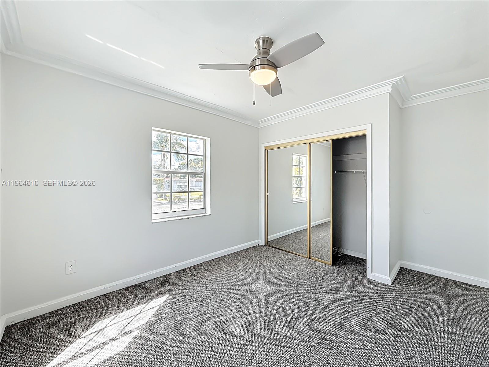 6819 Southwest 25th Street Miami, FL 33155 - Photo 17 of 25 a view of an empty room with a window