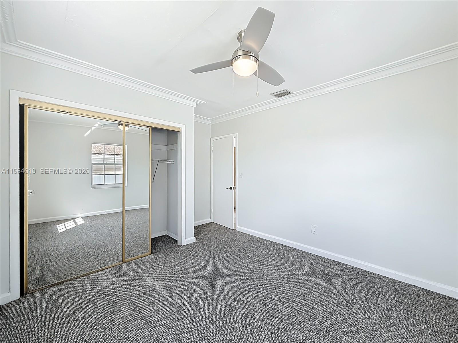 6819 Southwest 25th Street Miami, FL 33155 - Photo 18 of 25 a view of an empty room with a window