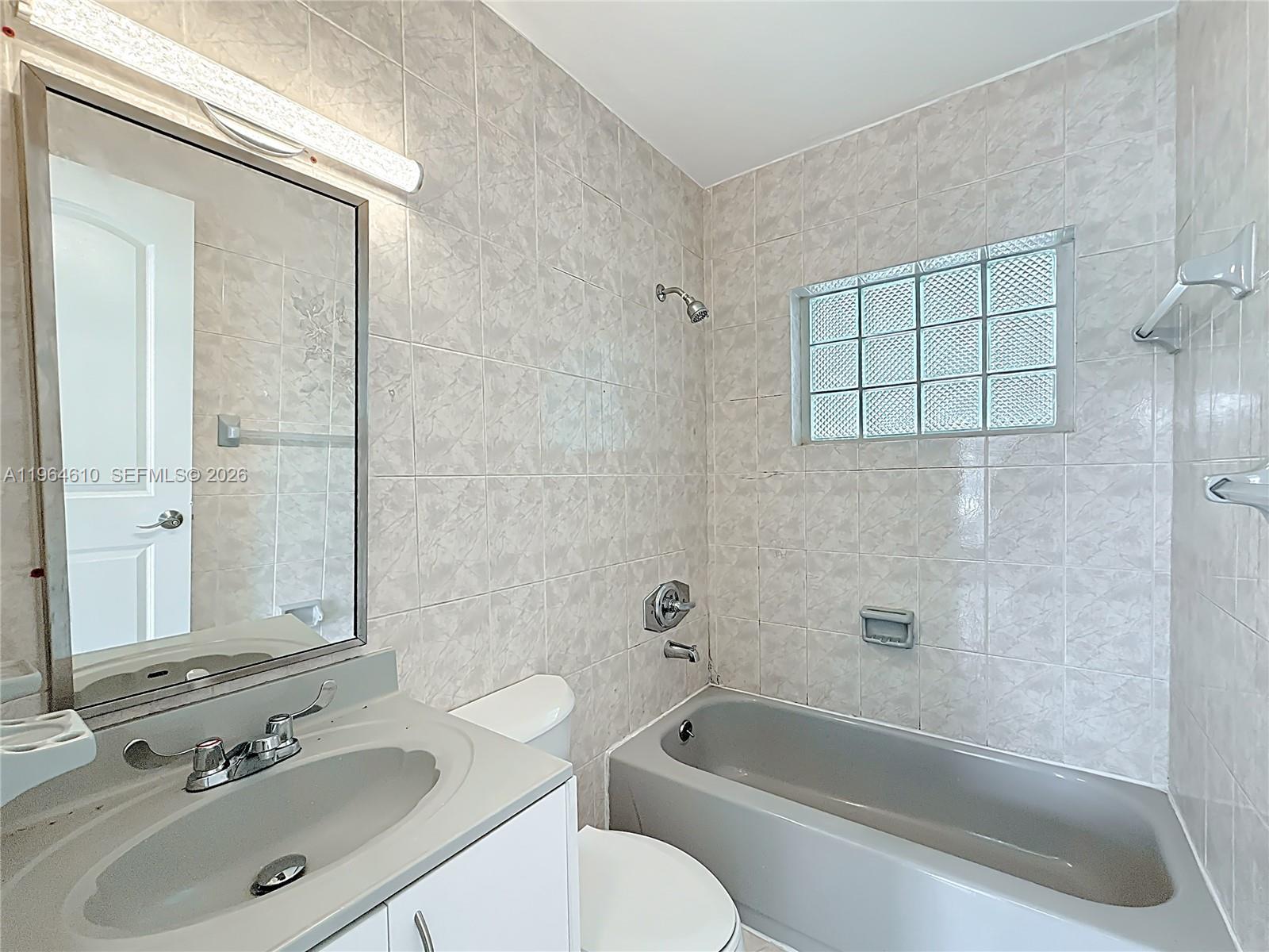 6819 Southwest 25th Street Miami, FL 33155 - Photo 19 of 25 a bathroom with a sink toilet and shower