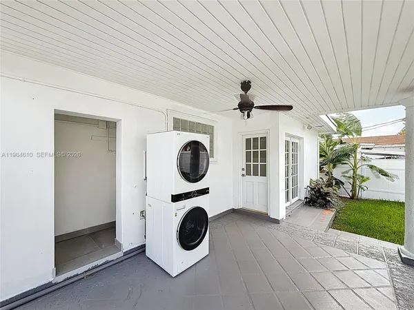 a view of a hallway with washer and dryer