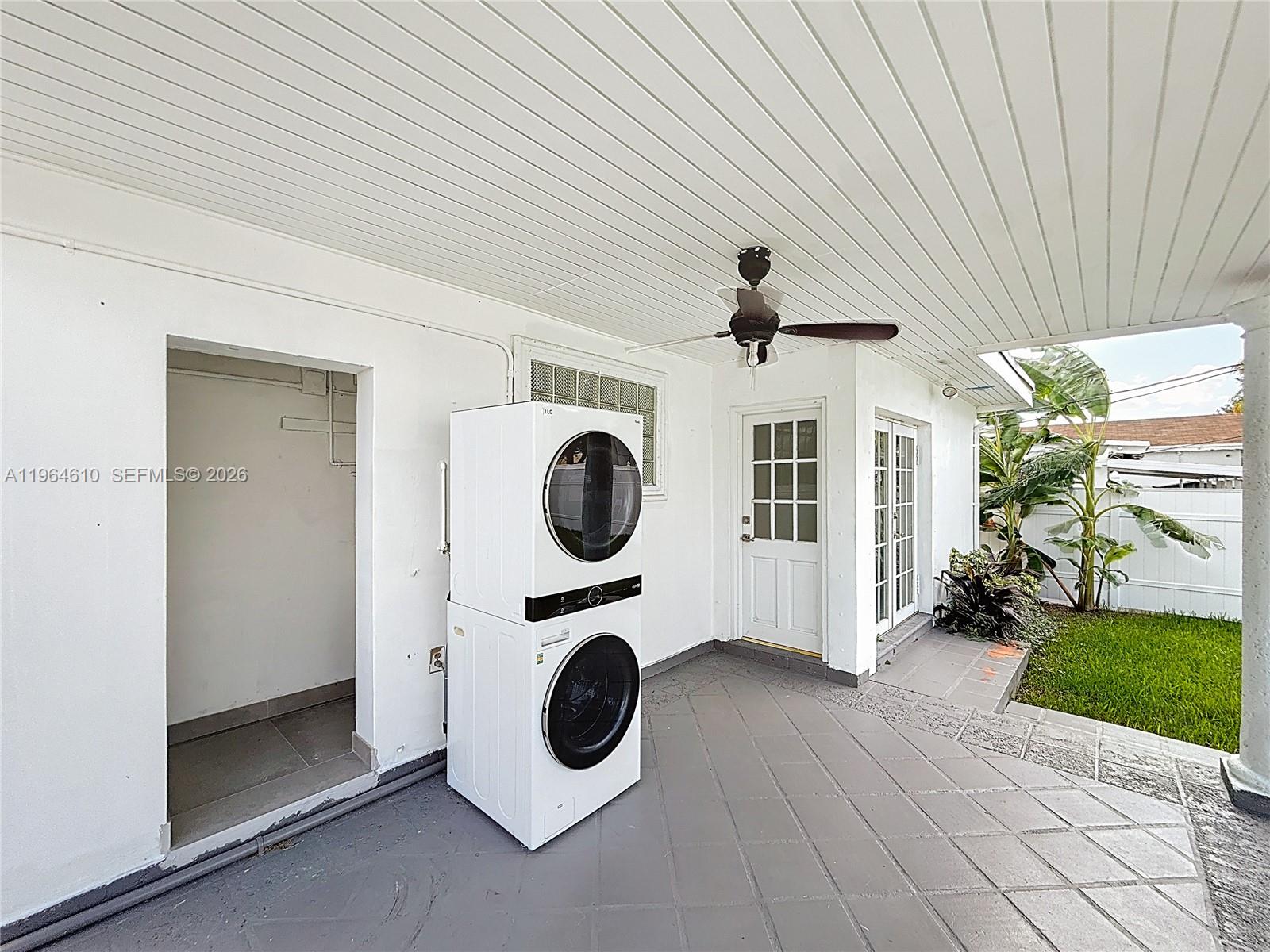 6819 Southwest 25th Street Miami, FL 33155 - Photo 20 of 25 a view of a hallway with washer and dryer