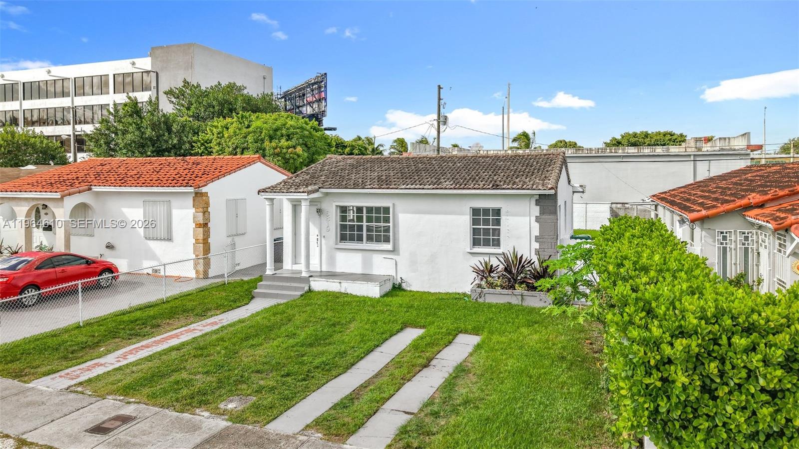 6819 Southwest 25th Street Miami, FL 33155 - Photo 2 of 25 a aerial view of a house with swimming pool and a garden