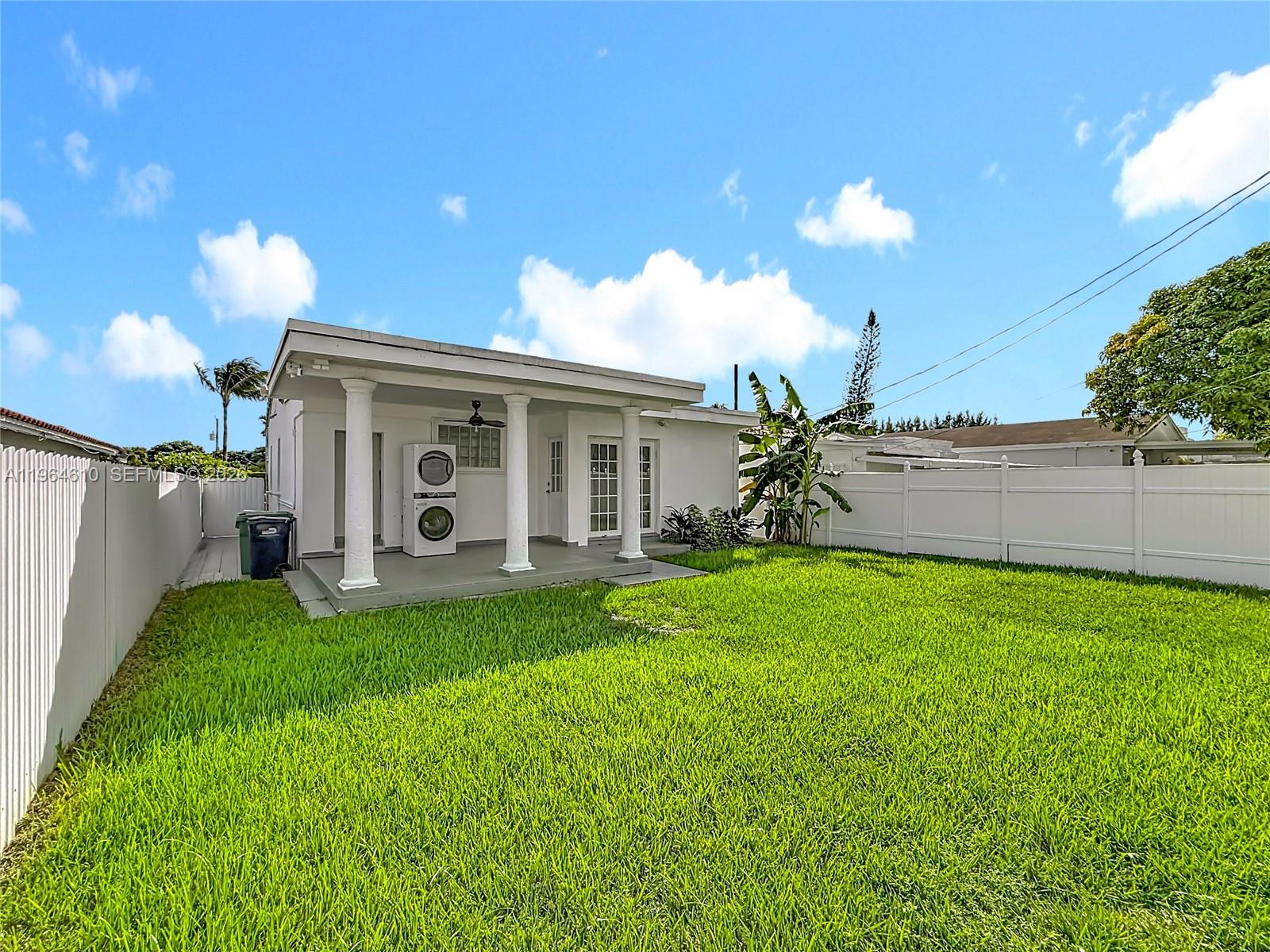6819 Southwest 25th Street Miami, FL 33155 - Photo 22 of 25 a view of a house with backyard