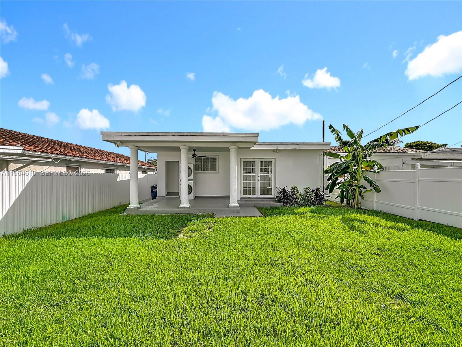 6819 Southwest 25th Street Miami, FL 33155 - Photo 23 of 25 a view of a house with backyard porch and sitting area