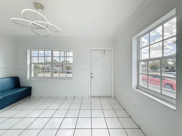 a view of an empty room with a window