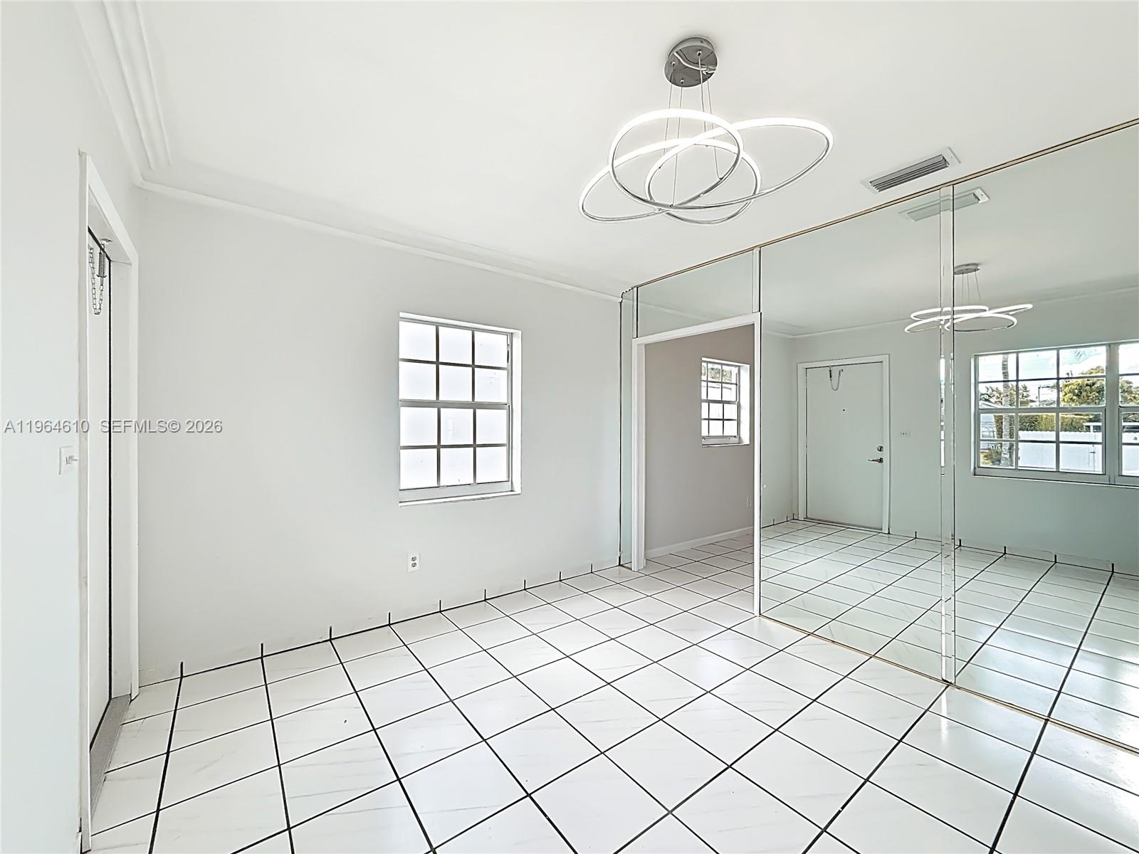6819 Southwest 25th Street Miami, FL 33155 - Photo 4 of 25 a view of an empty room and window